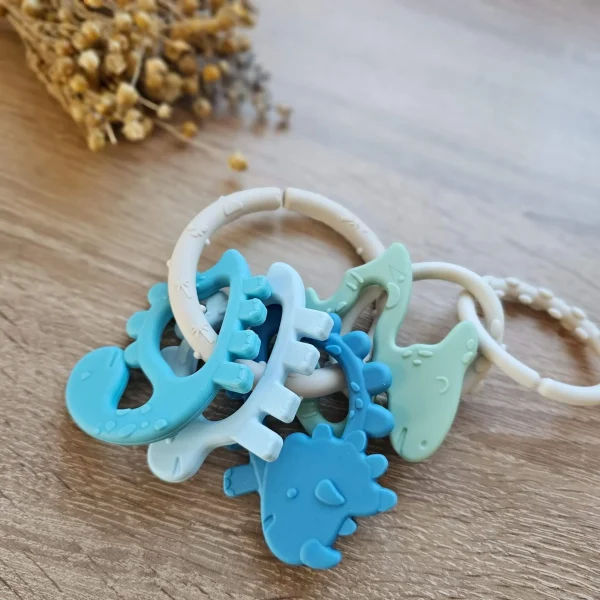 Anneau de dentition Dino "bleu" — Millhouse Jouet éducatif École